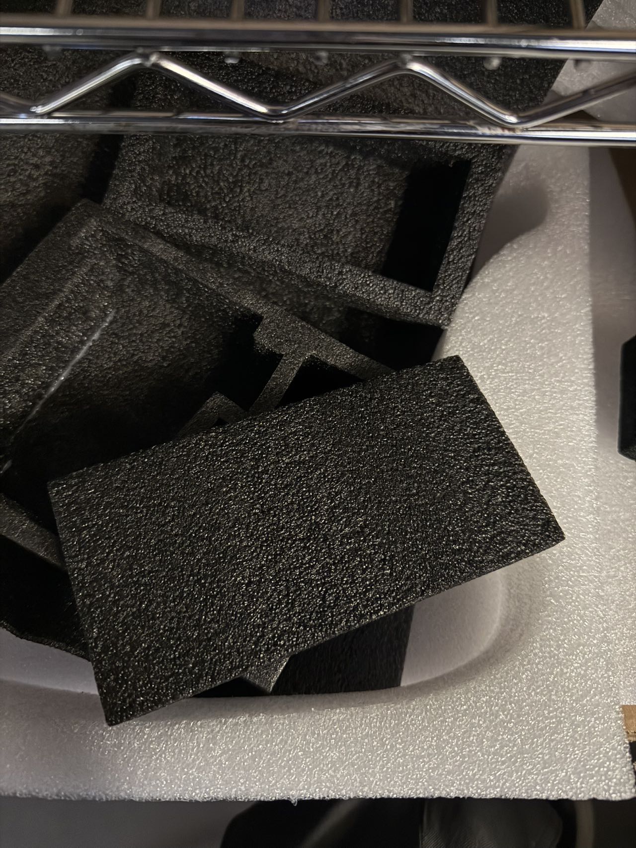 Black textured foam sheets and white foam